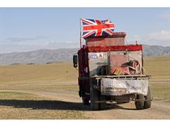 The 'Great Balls of Fur' team driving their furry fire engine through the deserts of Mongolia